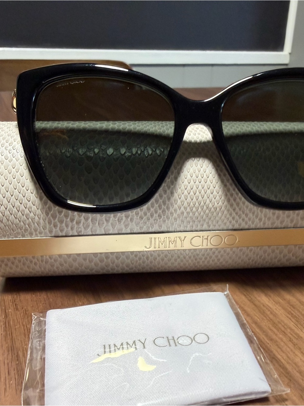 Jimmy Choo Black Cat-Eye Sunglasses with Green-Tinted Lenses